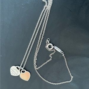 Return to Tiffany&Co small heart pendant necklace. Light pink double heart.